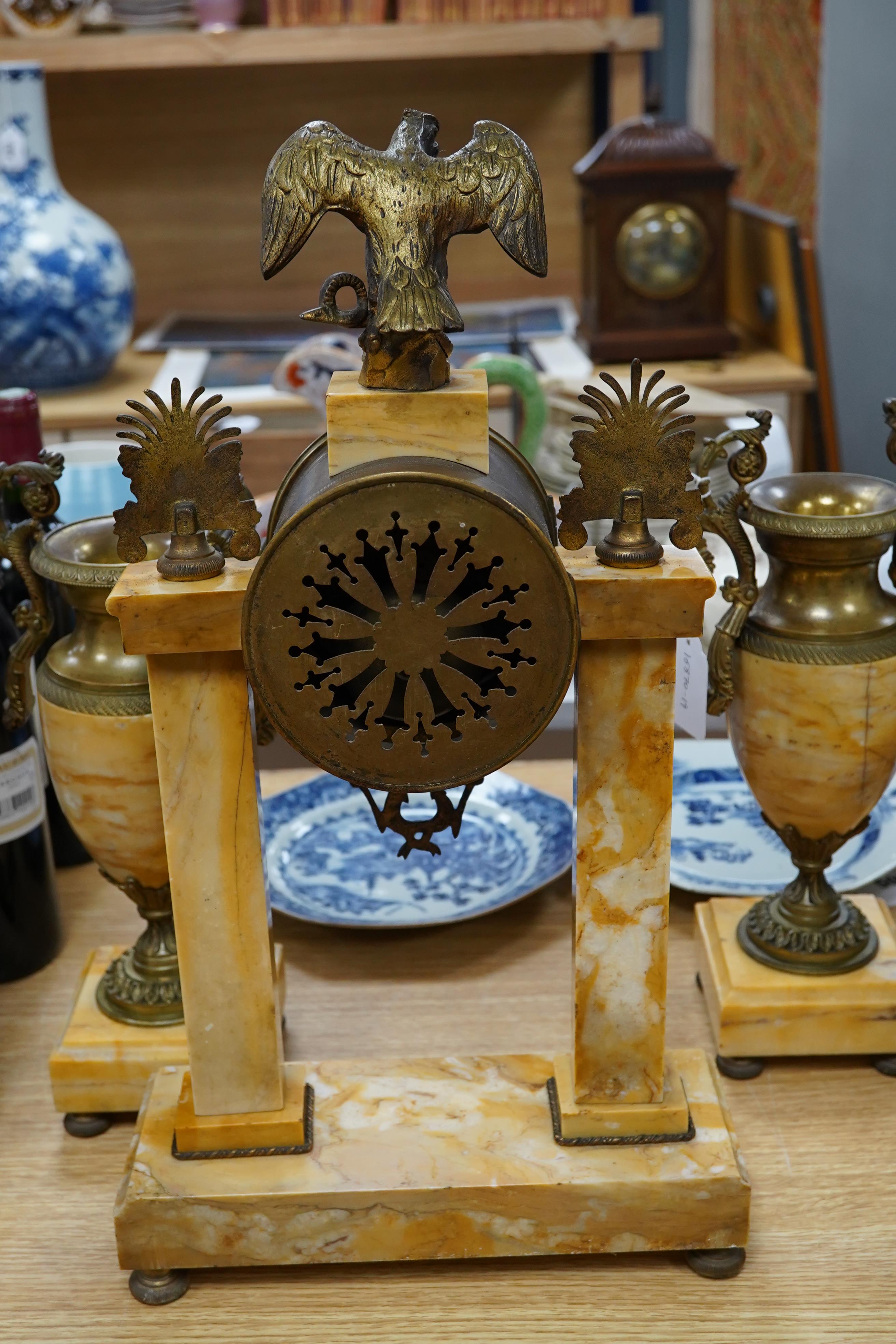 A 19th century French Sienna marble and gilt bronze clock garniture, with eagle surmount to clock, 48cm high. Condition - good